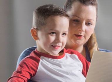 Brodie and his mum together, reading from a piece of paper