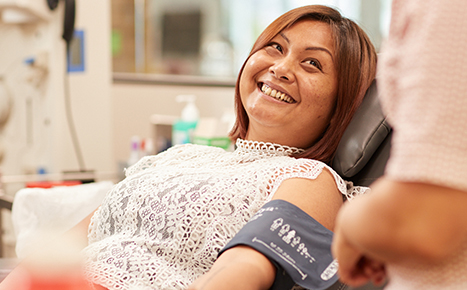 Female donor smiling in donor chair