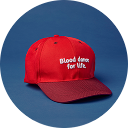 a red cap with blood donor for life written on it