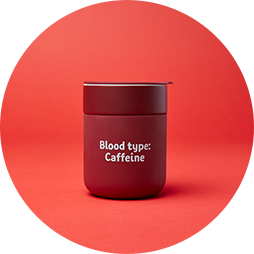 a reusable takeaway cup in dark red