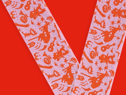 true colours bandage design with motifs in orange on a pink background