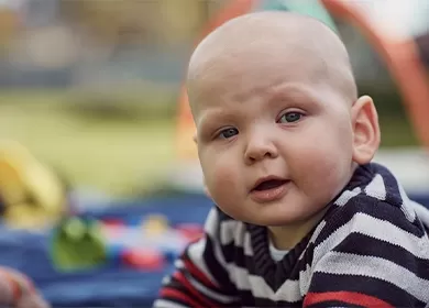 close up of a baby looking at the camera