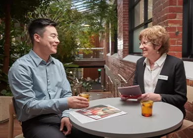 Male and female Lifeblood employees in meeting together