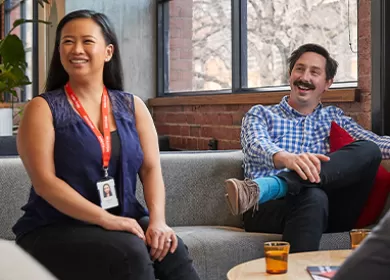 Female and male Lifeblood colleagues engaging in group conversation