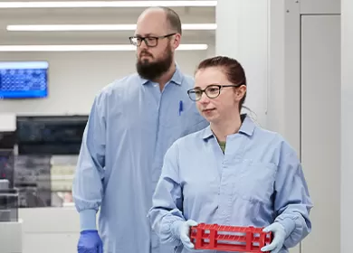 Female and male Lifeblood laboratory technicians walking together