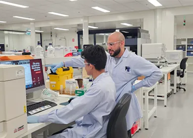 Two scientists working on a computer 