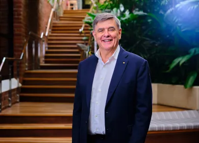 Lifeblood CEO Brendan Murphy standing infront of stairs smiling