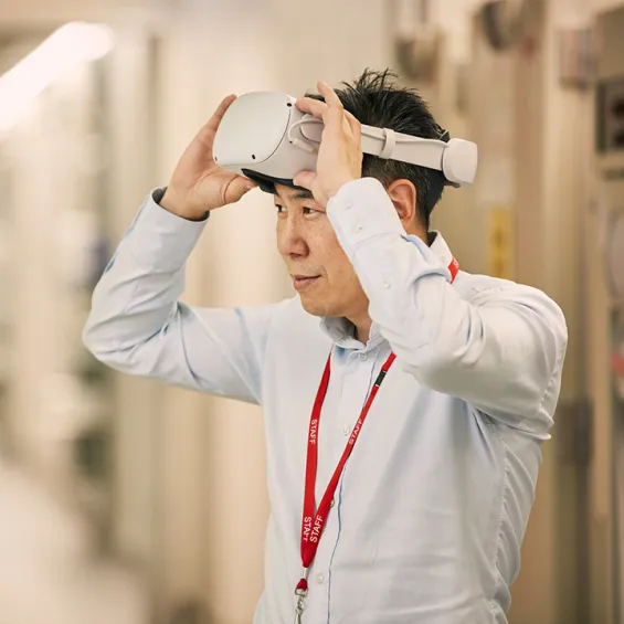 a man putting VR goggles on