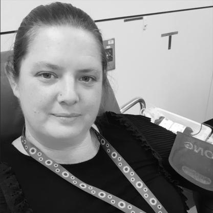 lady taking a selfie while donating blood