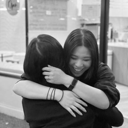 two women lovingly hugging