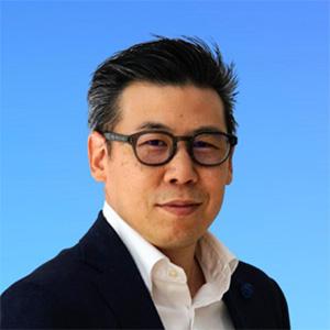 profile photo of alex wearing glasses, black suit jacket and white shirt