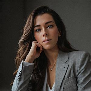 profile photo of sophie wearing a grey suit jacket and white shirt