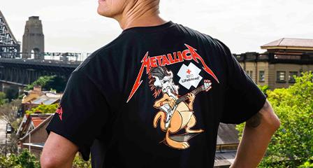 Michael Klim wearing the Lifeblood and Metallica collab t-shirt looking towards the Sydney harbour bridge